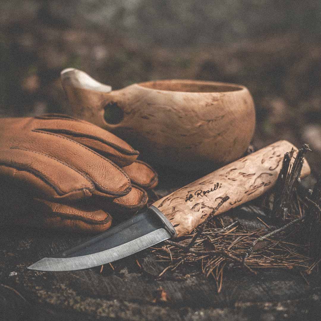Handmade Finnish hunting knife with a full tang blade and a handle made out of curly birch