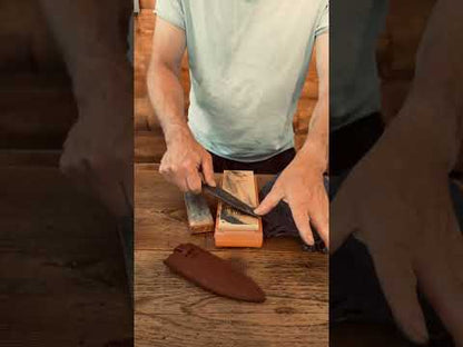 Roselli knife being sharpened on a Shapton Kuromaku #1000 sharpening stone to restore a razor-sharp edge.